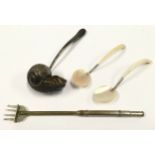 Silver plated snail ladle together with a pair of mother of pearl teaspoons and a fork.