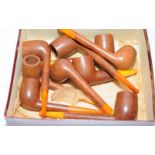 Collection of vintage briar pipes with amber mouthpieces, makes such as L&Co, Peterson's and CM. All