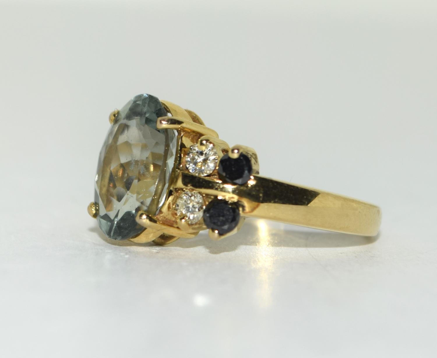 Yellow metal Black and White Diamond with Blue Topaz centre stone. Size Q. - Image 4 of 5
