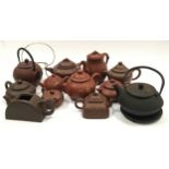 Collection of oriental terracotta teapots (12).