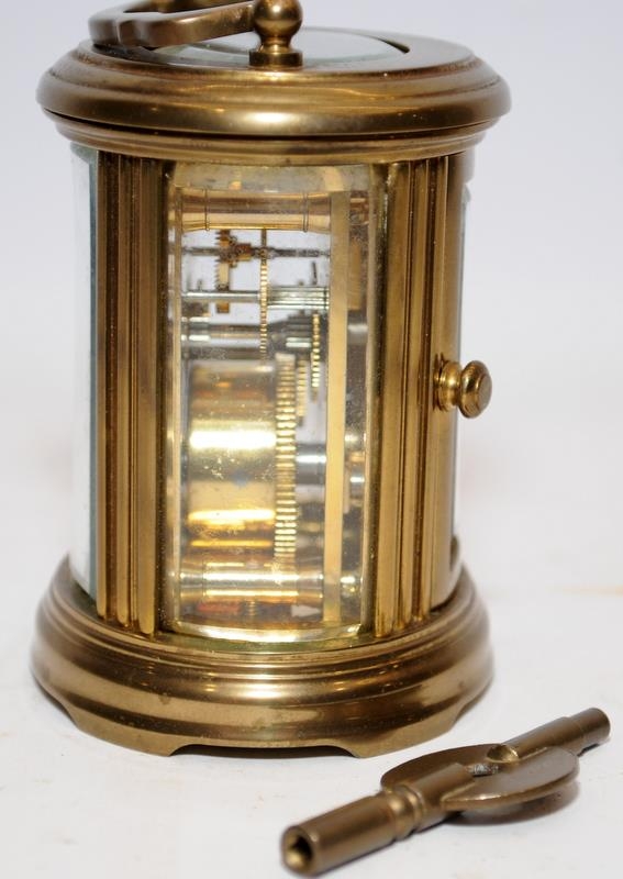Quality Matthew Norman miniature oval carriage clock with key. Seen working. All bevelled glass - Image 2 of 5