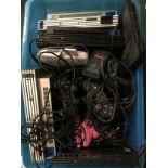 Various Playstation consoles, controllers and power supplies.