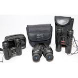 Three pairs of cased compact binoculars by Tasco, Halina and Praktica