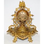 Antique French Ormolu striking mantel clock in ball form surrounded by bows, swags and leaves,