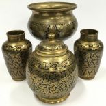 A set of brass and black enamel decorative pieces (4).