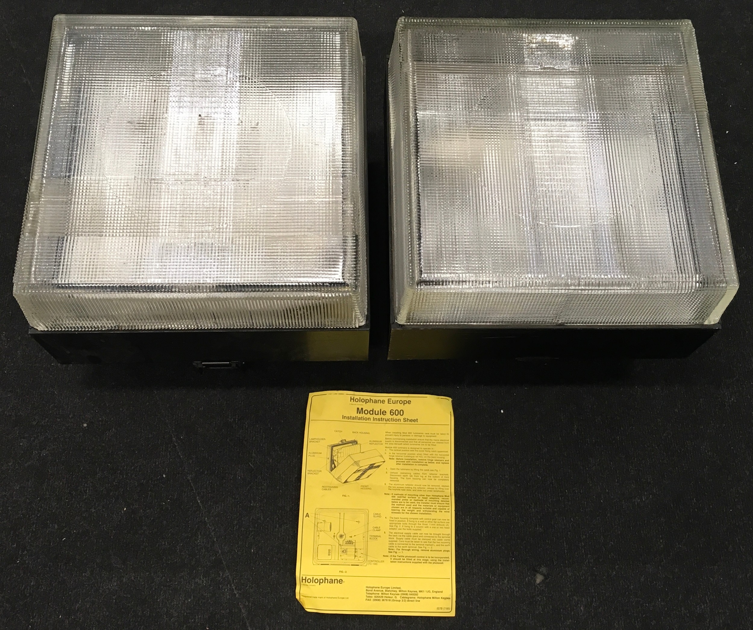 A pair of Holophane Module 600 industrial lamps each measuring 30x42x42cm.