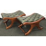 Pair of Chesterfield style green leather button studded foot stools each measuring 38x70x44cm.