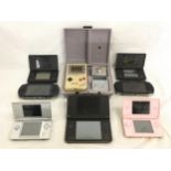 Various handheld gaming consoles to include Nintendo DS, PSP and Nintendo Gameboy with games.