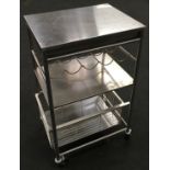 A stainless steel catering trolley 90x55x42cm.