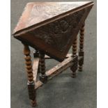 Victorian oak handkerchief/corner table with heavily carved decoration 74x59x60cm.