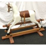 Antique carved wooden child's rocking horse requiring some restoration but appears to rock freely