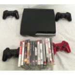 A PS3 console with controllers and games.