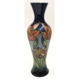 Moorcroft tall navy vase decorated with orange flowers 2001. 31cm tall. Signed and marked to base.