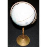 Floor standing large globe on wood and brass stand. Manufactured by George F Cram Co. Approx 95cms