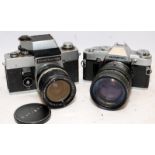 Two vintage 35mm SLR cameras, an Exacta RTL with fitted Soligor 1:2.8 28mm lens, and an Olympus OM30