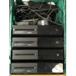 A box containing four Xbox one consoles, Kinects and power supplies.