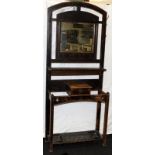 Antique oak hall stand in the Arts & Crafts style, with bevelled edge mirror over shelf with