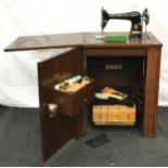 Singer model 66 vintage sewing machine complete with a large assortment of accessories and