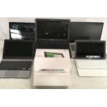 Various Laptops, tablets and an Apple Ipad.