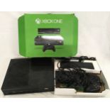 Boxed Xbox one console with accessories.