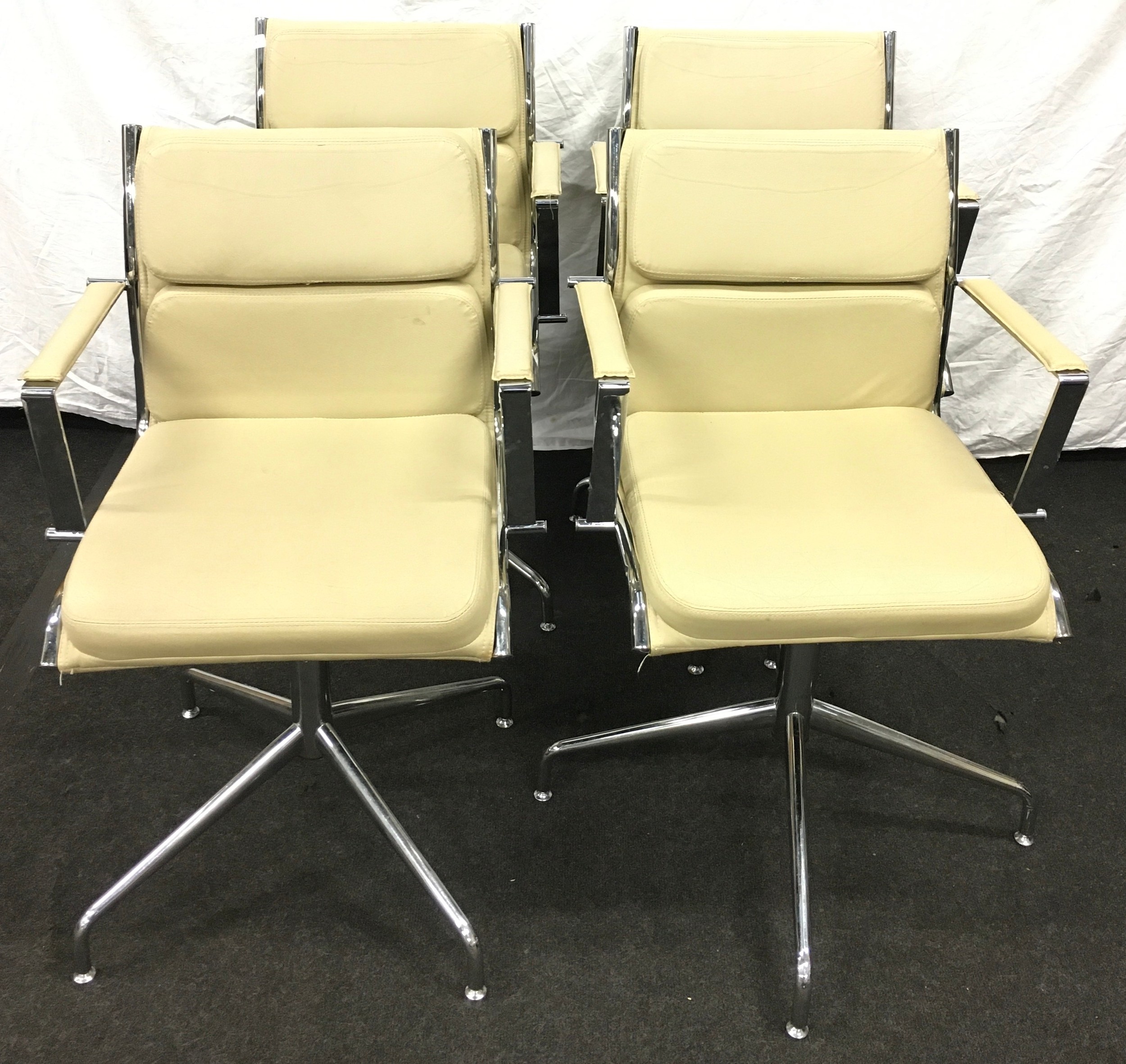 Set of four mid century Quinti Sedute chrome and leather swivel chairs.