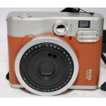 Fujifilm Instax Mini 90 Neo Classic instant print camera with tan finish. No charger so being sold