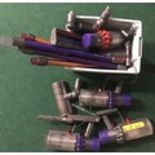 A collection of Dyson hoover parts.