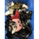 A collection of 39 various Xbox and PlayStation hand held controllers with various power supplies