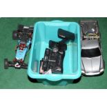 Two remote controlled vehicles with controllers.