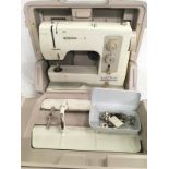 A Bernina Matic sewing machine in case with accessories.