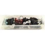 A box of various Xbox gaming controllers.