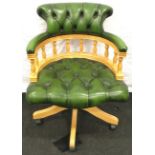 Chesterfield style green leather captain's swivel office chair. Some wear to the arm rests.
