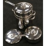 Collection of "Stellar" and "Suprema" stainless steel stacking set of pans for boiling/steaming in