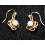 A pair of 9ct gold opal drop earrings.