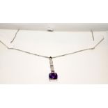 Amethyst and Diamond 18ct white gold pendant/chain in box.