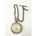 Omega pocket watch on a silver Albert chain.