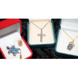 Opal brooches and crucifix.