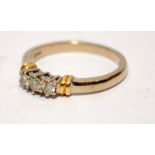 An 18ct gold three stone diamond ring, 3.8g, Size N