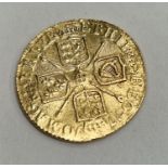 A gold 22ct Queen Anne 1/2 Guinea 1710