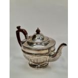 A walker and hall silver teapot.