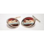 A pair of silver cufflinks with enamel nude images.