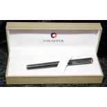 A Sheaffer pen in box.