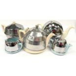 Collection of ceramic teapots and sugar bowl with chrome covers (5)