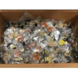 Box of various multiple cartoon pin badges.