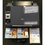 Epsom Stylus DX8400 multi function printer with two new packs of ink cartridges. Vendor advises this