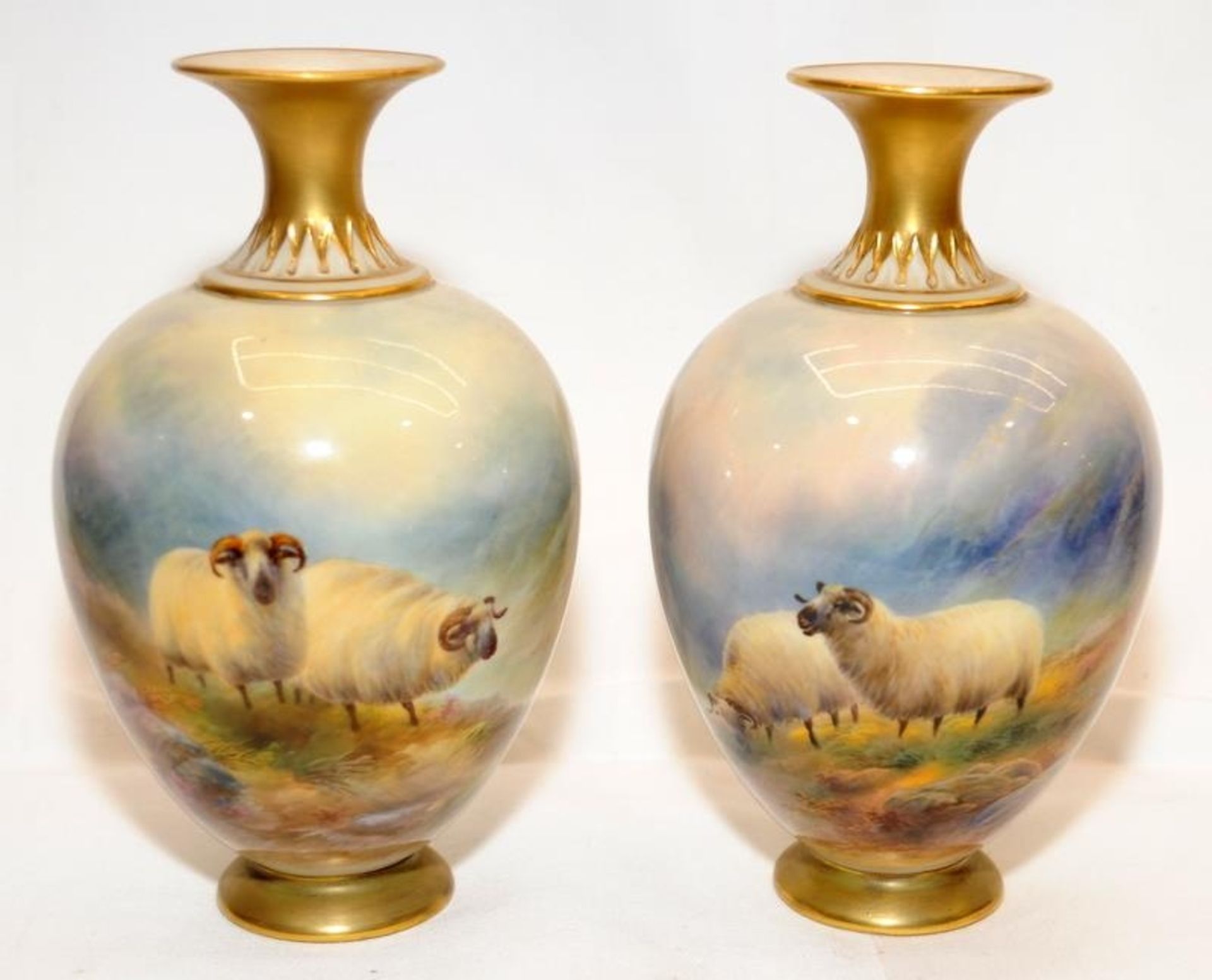 Pair of antique Royal Worcester blush ivory vases with gilded accents featuring hand painted