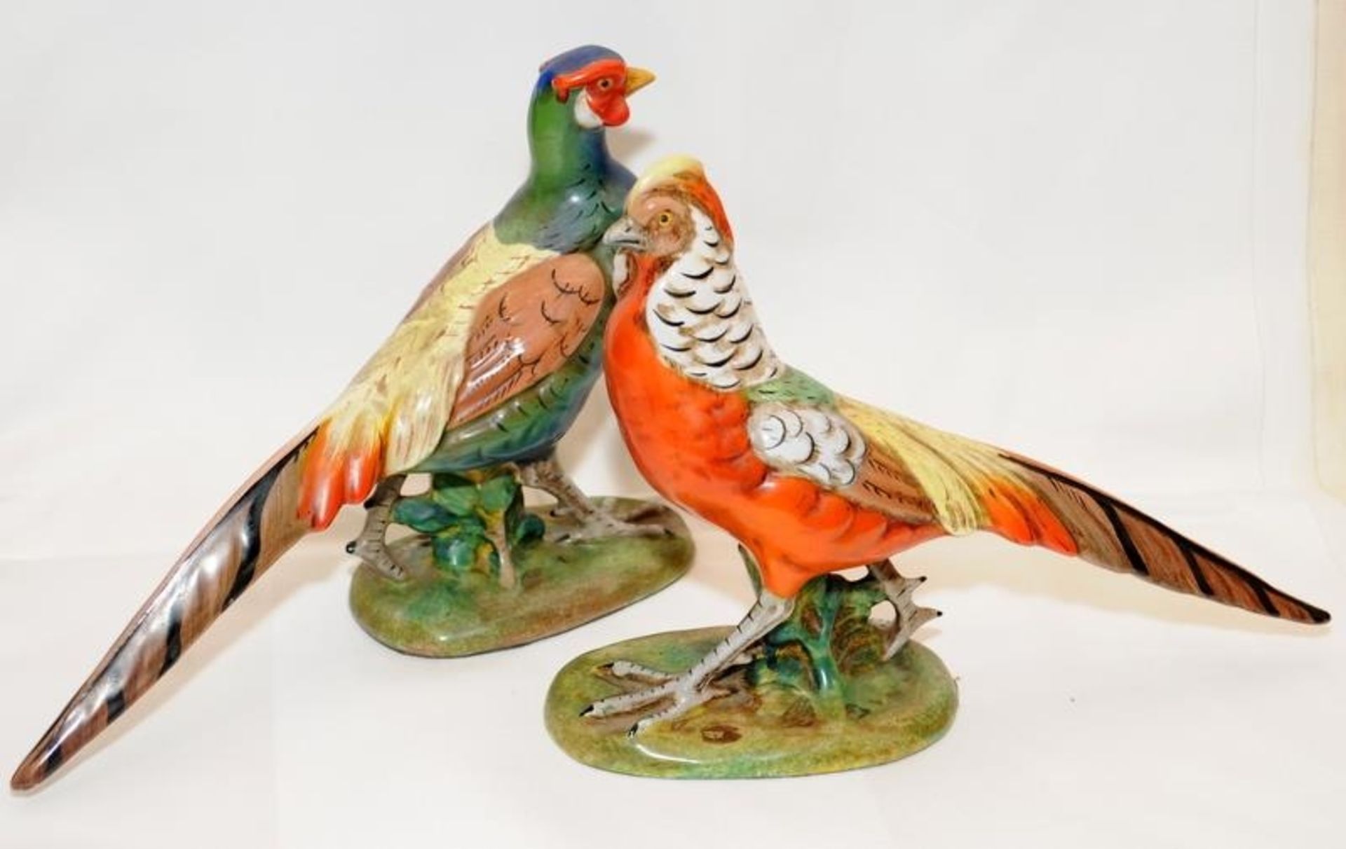A pair of quality early 20thC Italian pottery hand painted pheasants. Approx 28cms across