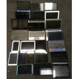 A box of various Tablets and Laptops.