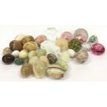 Collection of glass paperweights together with a large collection of marble eggs.