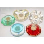 A collection of perspex One Pound and Two Pound coin paperweights issued by Royal Mint